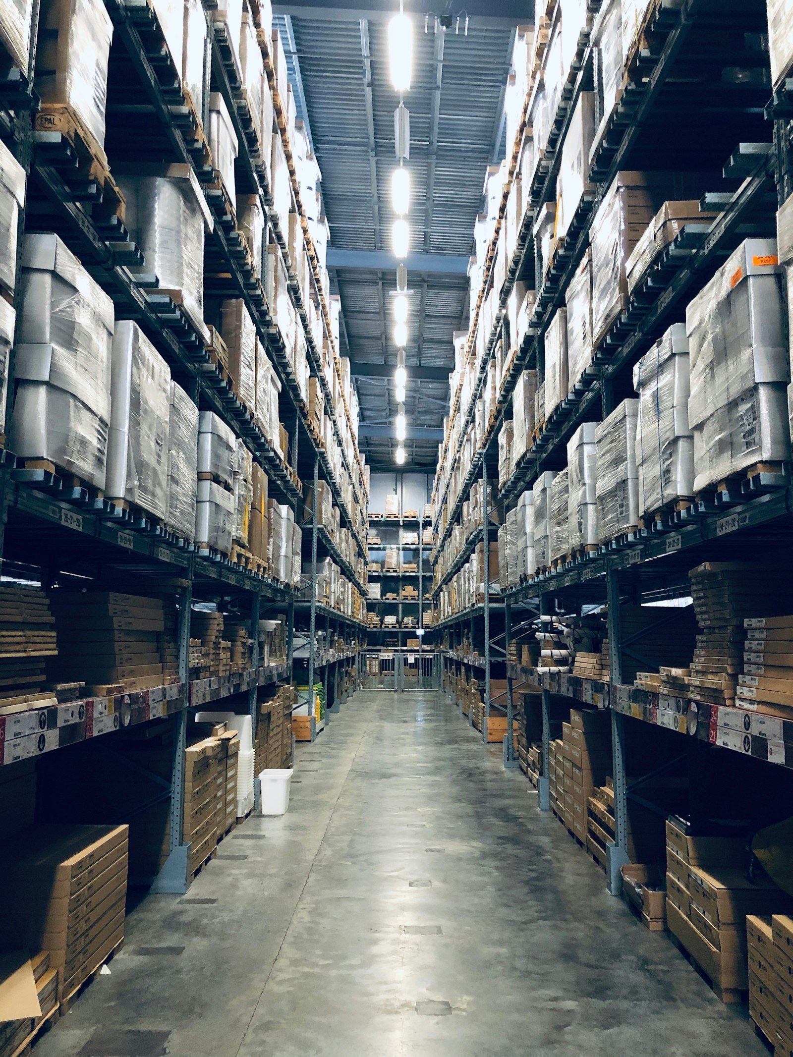 Warehouse racking stacked with palletized goods